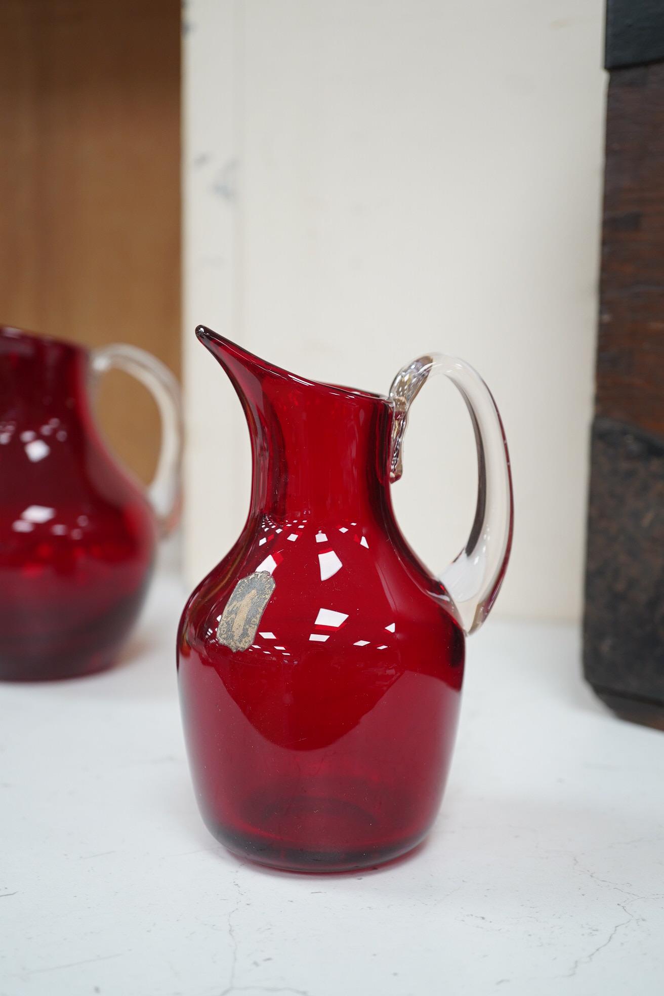 Seven red glass vases including Whitefriars, tallest 21cm high. Condition -good